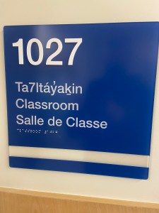 Signage in 3 languages: Sḵwx̱wú7mesh, English and French
